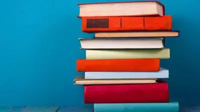 pile of books against blue background i stock